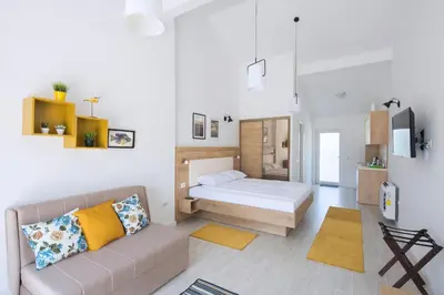 a living room with a couch and a bed at Luxurious Apartments Aria in Budva