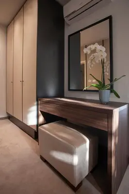 a dressing room with a bench and a mirror at Hotel Vela in Budva