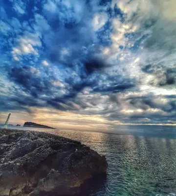 a cloudy sky over a body of water at Apartments Marina in Utjeha