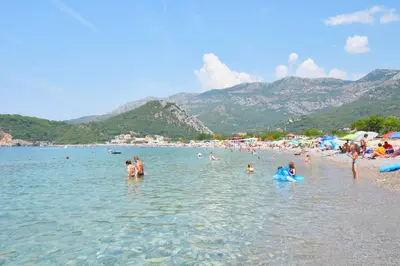 a group of people in the water at a beach at Apartments Siljak in Petrovac na Moru