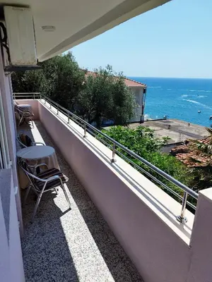 a balcony with chairs and a view of the ocean at Cosy Apartment in Ulcinj with Sea View - 40 m² in Ulcinj