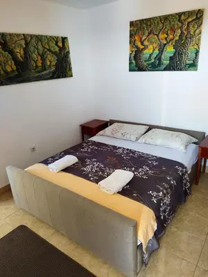 a bed in a room with two towels on it at Cosy Apartment in Ulcinj with Sea View - 40 m² in Ulcinj