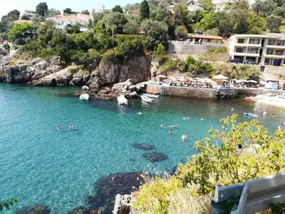 a group of people swimming in a body of water at Modern Studio with Sea View - Ulcinj - 25 m² - Balcony in Ulcinj