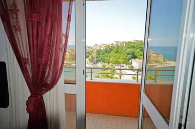 a room with a view of the ocean from a balcony at Sea View Apartment - Ulcinj - 40 sqm in Ulcinj