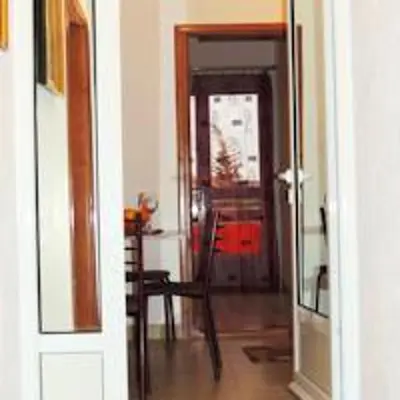 a hallway with a door leading to a dining room at Sea View Apartment - Ulcinj - 40 sqm in Ulcinj
