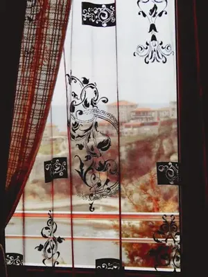 a window with black and white graphics on it at Sea View Apartment - Ulcinj - 40 sqm in Ulcinj