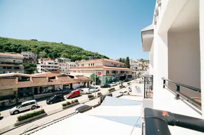 arial view of a city with cars parked in a parking lot at Hotel Dajti in Ulcinj