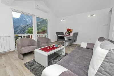 a living room with a couch and a table at Apartment Kalle in Kotor