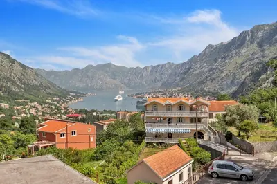 a view of a town with mountains in the background at Apartment Kalle in Kotor
