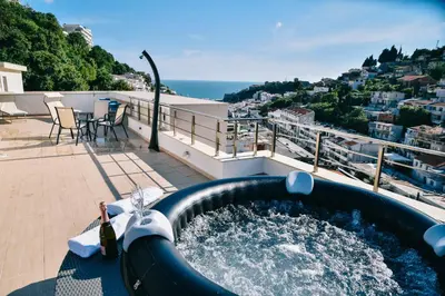 a large water slide on the roof of a house at Riva Luxury in Ulcinj