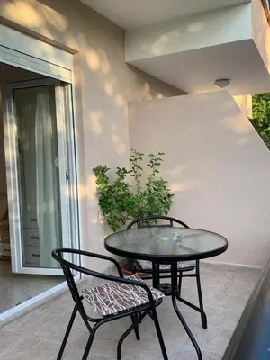 a table and two chairs sitting on a patio at Guesthouse P&A in Budva