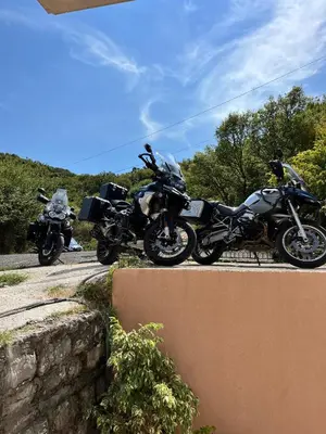 two motorcycles parked on the side of a road at Guesthouse P&A in Budva