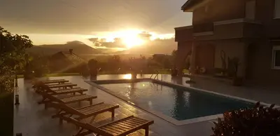 a group of chairs sitting next to a swimming pool at Villa Mina in Kotor