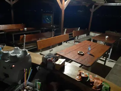 an overhead view of a dining room with wooden tables and chairs at Livari Viewpoint in Livari