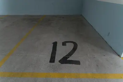 a number painted on the floor of a parking lot at Apartman Natalia in Budva