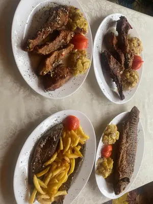four plates with different types of food on a table at Ethno village Moraca - Skadar lake in Vranjina