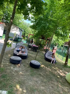 a group of children playing on a playground at Ethno village Moraca - Skadar lake in Vranjina