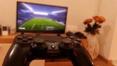 a video game controller sitting in front of a television at Holiday Home Milanovic in Cetinje