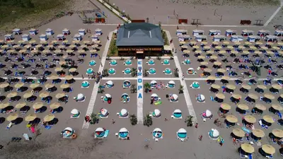 an overhead view of a parking lot with umbrellas at Hotel Halibas in Ulcinj