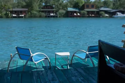 a group of chairs sitting on a dock near the water at Baraka in Ulcinj