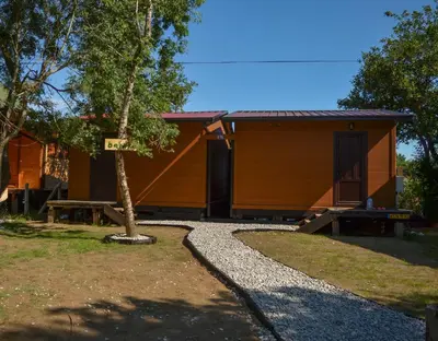 a cabin with a gravel path in front of it at Baraka in Ulcinj