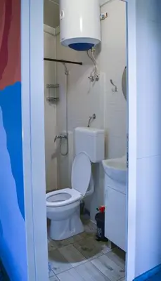 a bathroom with a toilet and a sink at Baraka in Ulcinj