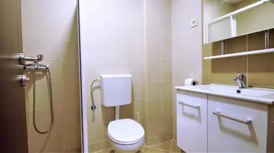 a bathroom with a toilet and a sink at Aleksa Lux apartment Budva in Budva