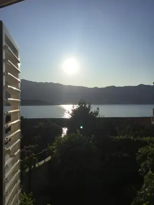 a view of the lake from the balcony of a building at Apartments Trifunovic Old Town in Budva