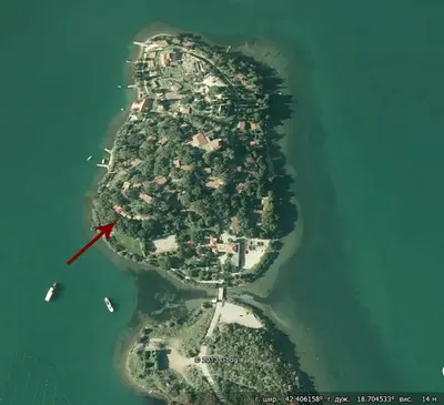 an island in the water with a red arrow at Seaside Story in Tivat
