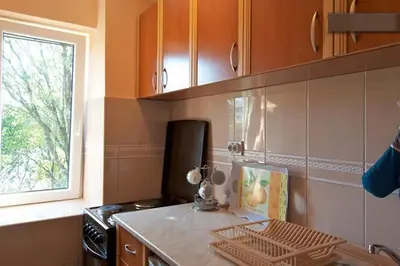 a kitchen with a counter top and a window at Seaside Story in Tivat
