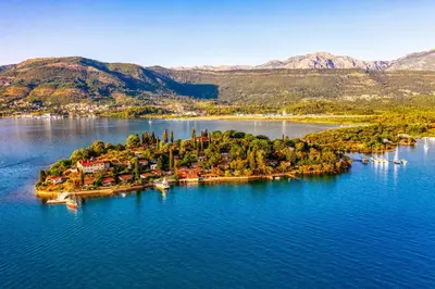an island in the middle of a large body of water at Seaside Story in Tivat