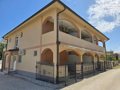 a building with arches on the side of it at Vila Cattleya in Donji Štoj