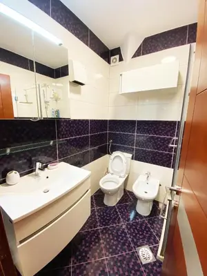 a bathroom with a toilet and a sink at Luxury apartment Podgorica in Podgorica