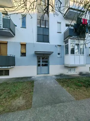 an apartment building with a door and a yard at Luxury apartment Podgorica in Podgorica
