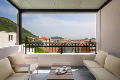 a living room with a large window with a view at Villa Lazy Hill in Budva