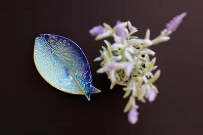 a blue butterfly sitting next to a flower at LORDOR Apartment in Budva