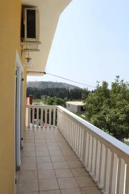a balcony of a house with a white railing at Vila AKI-KA in Sutomore