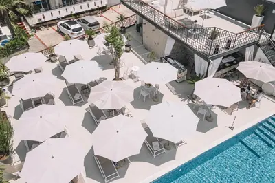 an overhead view of a patio with umbrellas and a pool at Padam Hotel & SPA in Ulcinj