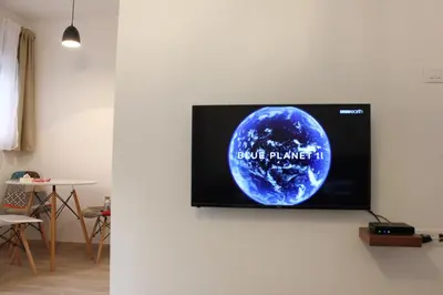 a flat screen tv hanging on a wall at Apartment Jabucanin in Cetinje