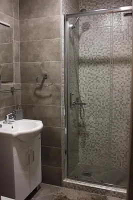 a bathroom with a shower and a sink at Apartment Jabucanin in Cetinje