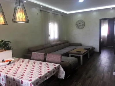 a living room with a couch and a table at Eko Apartmani Krackovic in Podgorica