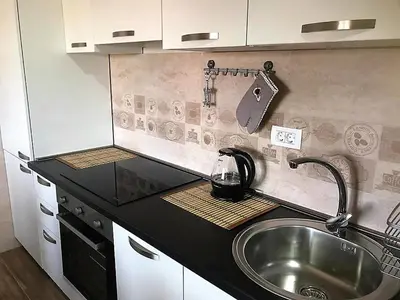 a kitchen with a sink and a counter top at Eko Apartmani Krackovic in Podgorica