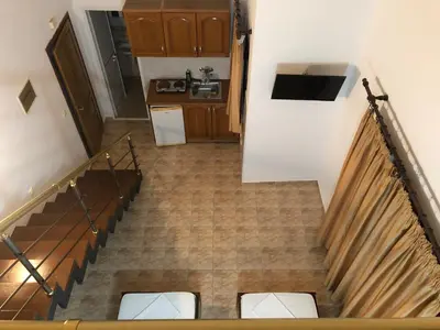 an overhead view of a staircase with a kitchen at Apartments Toni in Ulcinj