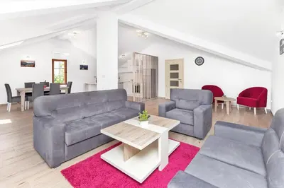 a living room with a couch and two chairs and a table at Apartments Mezini 11 in Kotor