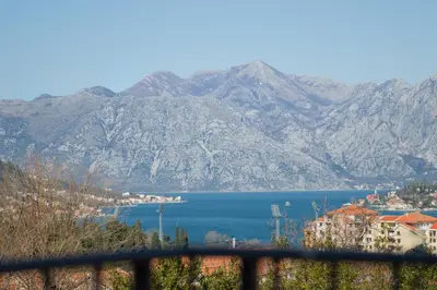 a view of a lake with mountains in the background at Apartments Mezini 11 in Kotor