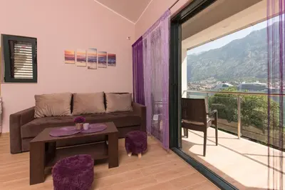 a living room with a couch and a table at Fortress View apartment in Kotor