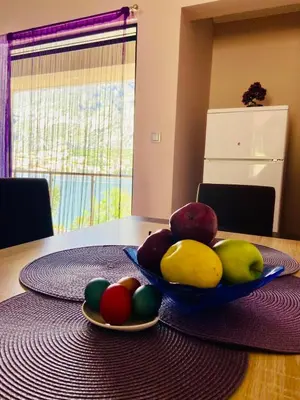 a bowl of fruit sitting on top of a table at Fortress View apartment in Kotor