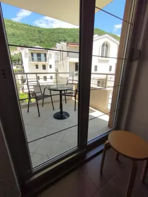 a view from a window of a patio with a table at Studio Alexandra in Petrovac na Moru