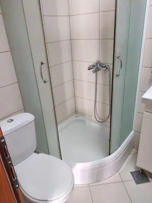 a bathroom with a shower with a toilet at Studio Alexandra in Petrovac na Moru