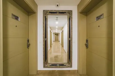 a hallway with a mirror on the wall at Hotel 219 Budva in Budva